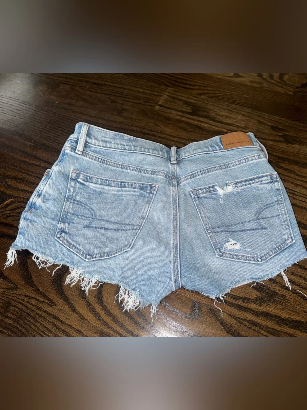American Eagle Outfitters Super Low Rise Perfect Shortie light Wash distressed